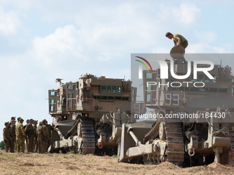 UNSPECIFIED, ISRAEL - JULY 19, 2014: IDF Bulldozers in an army deployment area near Israel's border with the Gaza Strip, on July 19, 2014,...