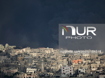 Smoke rises after Israeli shelling at Al Shejaiyaa neighbourhood in the east of Gaza City along the border between Israel and Gaza City on,...