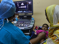 Bangladeshi Cardiologist gives echocardiography test to a child patient at National Institute of Cardiovascular Diseases in Dhaka, Banglades...