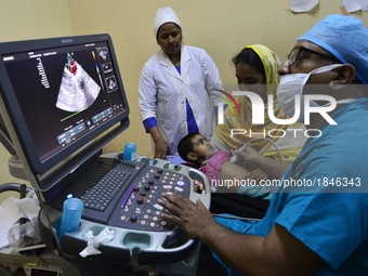 Bangladeshi Cardiologist gives echocardiography test to a child patient at National Institute of Cardiovascular Diseases in Dhaka, Banglades...