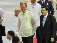 Bulacan, Philippines - Philippine President Benigno Aquino III (L) exits with Inglesia ni Cristo Executive Minsister Eduardo Manalo after th...