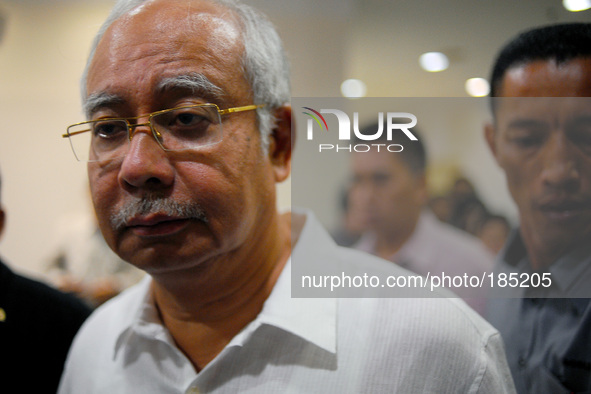 Malaysia's Prime Minister, Najib Razak leaves a hotel after meeting family members of passengers on board Malaysia Airlines, Mh17 in Putraja...