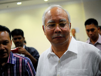 Malaysia's Prime Minister, Najib Razak leaves a hotel after meeting family members of passengers on board Malaysia Airlines, Mh17 in Putraja...