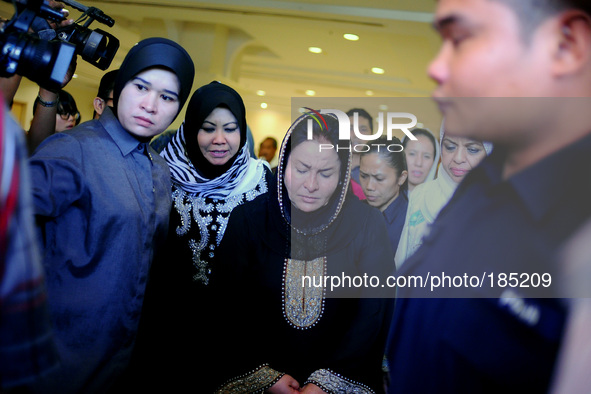 Malaysia's First Lady, Rosmah Mansor leaves a hotel after meeting family members of passengers on board Malaysia Airlines, Mh17 in Putrajaya...