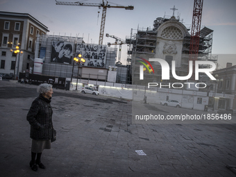 A woman in Piazza del Duomo (Duomo Palace) in L'Aquila, on March 21, 2017. The Eighth anniversary of the L'Aquila earthquake will be marked...
