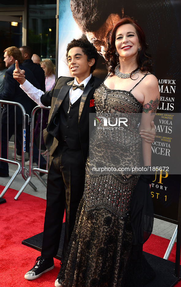 James Brown 11 and Tomi Rae Hynie Brown  attends the World Premiere of 