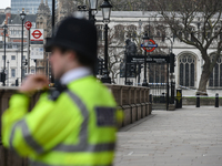 A police officer in front of Westminster Station in London, on March 23, 2017. Police continue investigations after the terror attack in Lon...