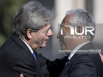 Portuguese Prime Minister Antonio Costa, right, is greeted by Italian Prime Minister Paolo Gentiloni during arrivals for an EU summit at the...