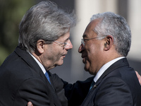 Portuguese Prime Minister Antonio Costa, right, is greeted by Italian Prime Minister Paolo Gentiloni during arrivals for an EU summit at the...