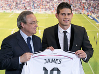 James Rodriguez AND club president Florentino Perez during his unveiling as a new Real Madrid player at the Santaigo Bernabeu stadium on Jul...