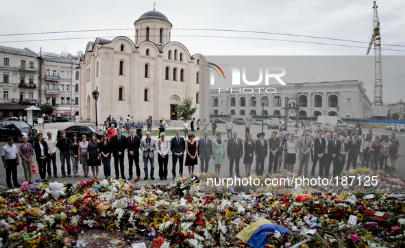 KIEV, UKRAINE - JULY 23: Employees of Netherlands Embassy to Ukraine hold a  minute of silent for victims of MH-17 air crash 
