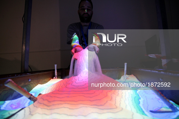 Augmented reality sandbox allows users to create topography models by shaping real sand, which is then augmented in real time by an elevatio...