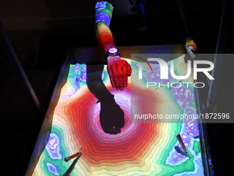 Augmented reality sandbox allows users to create topography models by shaping real sand, which is then augmented in real time by an elevatio...