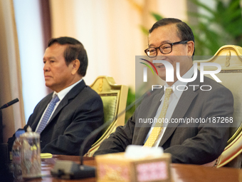 Sam Rainsy, president of Cambodia National Rescue Party smiles during the meeting with Prime Minister Hun Sen at Senate in Phnom Penh on 21,...