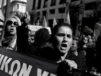 Cleaning ladies at Greek schools, shout slogans against low wages during a protest at the Labor Ministry, in Athens on Friday, March 31, 201...