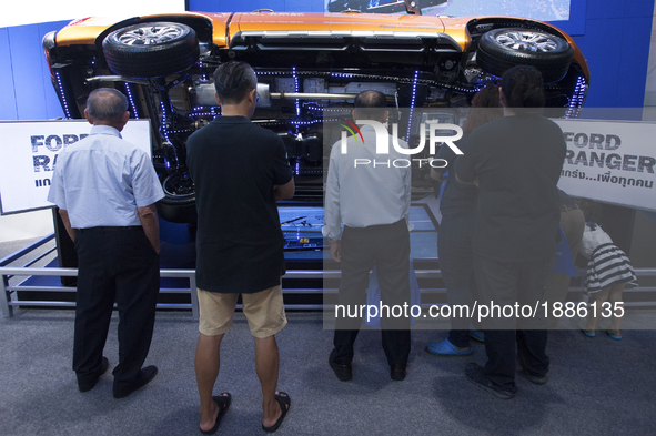People look at Ford Ranger cars on display during the 39th Bangkok International Motorshowin Bangkok, Thailand, on April 7, 2017. 