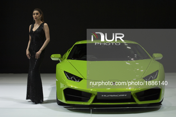 A model works for Lamborghini during the 38th Bangkok International Motor Show in Bangkok, Thailand, on April 7, 2017. 