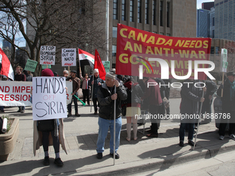 Protest against US President Donald Trump's decision to launch airstrikes against Syria on April 8, 2017 in Toronto, Ontario Canada. Protest...