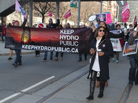 Rally to pressure the Ontario government to keep Hydro public and stop the privatization of Hydro One in downtown Toronto, Ontario, Canada,...
