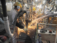 KARAWANG, WEST JAVA,APRIL-11  : Workers connect components to be a car body plate at Toyota Motor Manufacturing Indonesia, Karawang, West Ja...