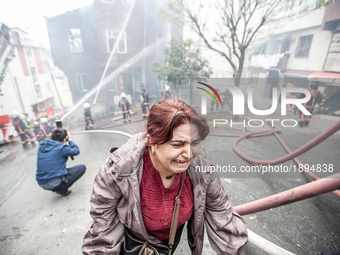 A woman cry during a fire in a building in Kurtulus, Istanbul, on April 12, 2017. Fire was for an electrical fault. Fire department of Istan...