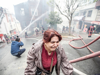 A woman cry during a fire in a building in Kurtulus, Istanbul, on April 12, 2017. Fire was for an electrical fault. Fire department of Istan...