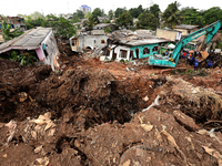 Heavy machinery are used by Sri Lanka Army personnel during rescue operations at the collapsed garbage mountain in Meethotamulla, Colombo, S...