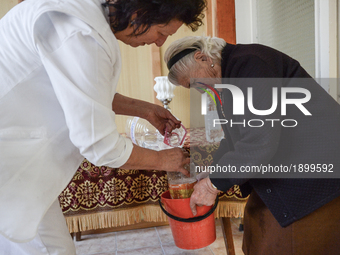 an elderly woman receive her bottle of clean water in the home for elderly people in Haskovo, Bulgaria, where near 156 elderly people live....