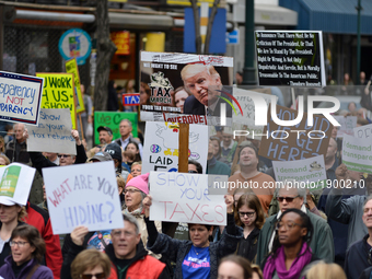 Protestors participate in a Tax Day March in Center City Philadelphia, on April 15, 2017. Around the nation thousands are expected to partic...
