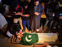 Kashmiri Muslim take part in the funeral prayers of  Shabir Ahmed, a teenage boy During his funeral procession   in Srinagar, Indian control...