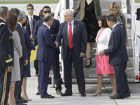 U.S. Vice President Mark Pence and Lim Sung Nam of South Korean First Vice Foreign minister shake hands after arrives at the Osan military A...