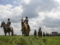 Women and men ride during the traditional horse riding procession on Easter Monday in Zernica village near Gliwice, Poland, 17 April 2017. D...