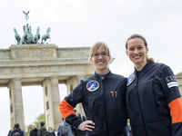Nicola Baumann (R) and and Insa Thiele-Eich (L) pose for a picture in front of the Brandenburg Gate after having been nominated as the next...