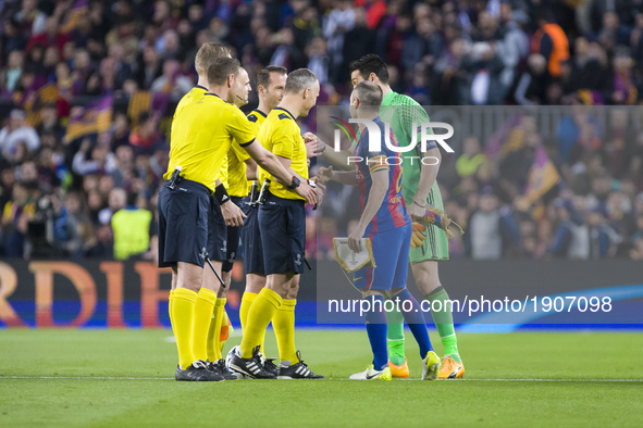 The referees, Andres Iniesta of FC Barcelona and Gianluigi Buffon of Juventus FC during the UEFA Champions League Quarter Final second leg m...