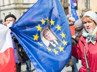Supporters of former Polish Prime Minister, President of the European Council Donald Tusk follow him on his way to the prosecutor's office i...