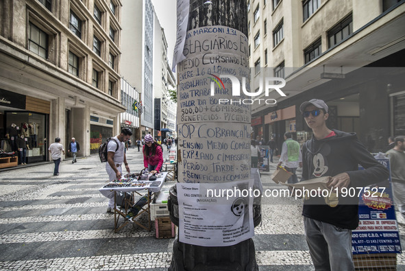 People observe job ads in the center of São Paulo, on April 19, 2017. The world unemployment rate is expected to rise from 5.7 percent in 20...