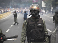 A member of FANB (Fuerzas Armadas de Venezuela)  during a march against Venezuelan President Nicolas Maduro, in Caracas on April 19, 2017. V...