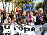 French 'Parti de Gauche' (PG) far-left party's leader, Jean-Luc Melenchon (C), gestures beside French Communist Party's leader Pierre Lauren...
