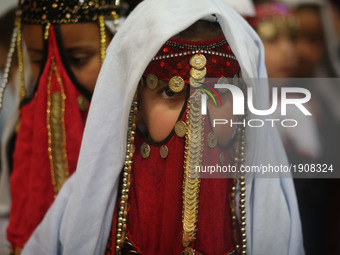Bedouin girls wears traditional dress during Folklore Exhibition in Gaza city, Palestine,  on April 20, 2017. (
