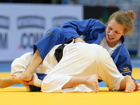 Theresa Stoll (GER, blue), Helene Receveaux (FRA, white), compete during the European Judo Championships in Warsaw, April 20, 2017. (