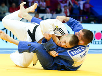 Damian Szwarnowiecki (POL, white), Bojan Dosen (SRB, blue), fight during the 2017 Warsaw European Judo Championships (20-23 April) at the To...