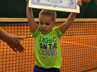 Dmytro Kuzminov ( 3 year,9 month old) from Odessa, shows a certificate about his registration as the youngest tennis player in Ukraine, in K...