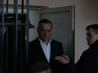 Ukrainian former lawmaker Mykola Martynenko, who is under investigation over the suspected embezzlement, is seen sent into the defendant's c...