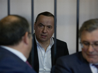 Ukrainian ex-lawmaker Mykola Martynenko, who is under investigation over the suspected embezzlement, speaks inside the defendant's cage as h...
