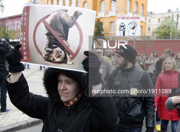 Ukrainian activists with dogs carries posters, as they attend the International march for animal rights in center of Kiev, Ukraine, 22 April...