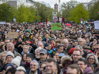 People attending the 'March for Science' gather in front of Brandenburg Gate to express their support to science and research in Berlin, Ger...