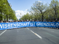 People attending the 'March for Science' hold a banner reading 'science is without borders' in Berlin, Germany on April 22, 2017. Thousands...