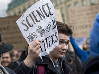 A guy attending the 'March for Science' holds a banner reading 'science matters' in Berlin, Germany on April 22, 2017. Thousands of people r...
