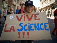 A young girl poses with a placard reading 'Go! for science' during a march for Science. It took place in Toulouse, France, on 22 April 2017,...