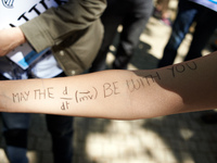 A woman has written on her arm 'May the Force be with you'. A march for Science took place in Toulouse, France, on 22 April 2017, for Earth'...